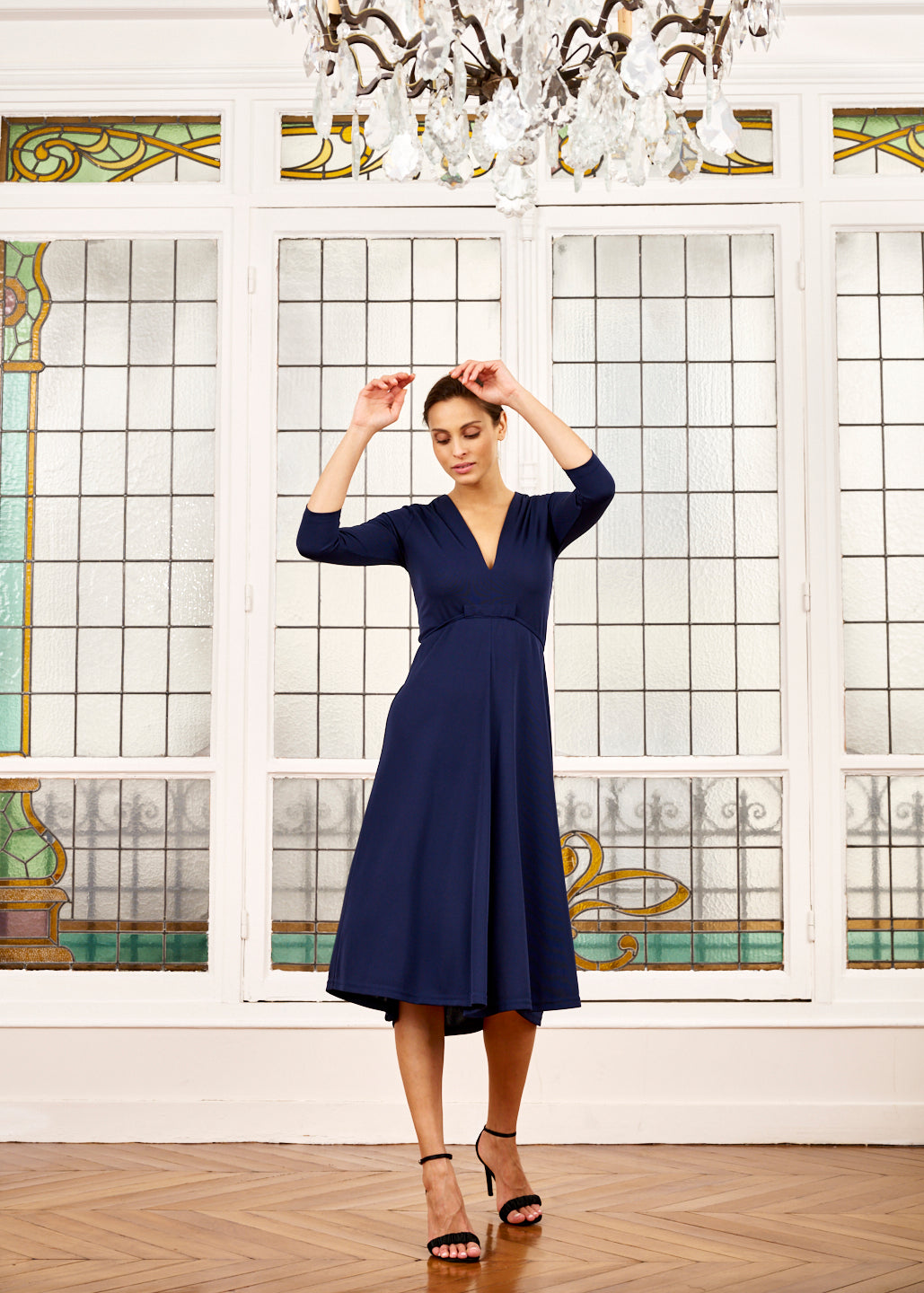 Woman models Elegance Miss navy midi dress with sleeves