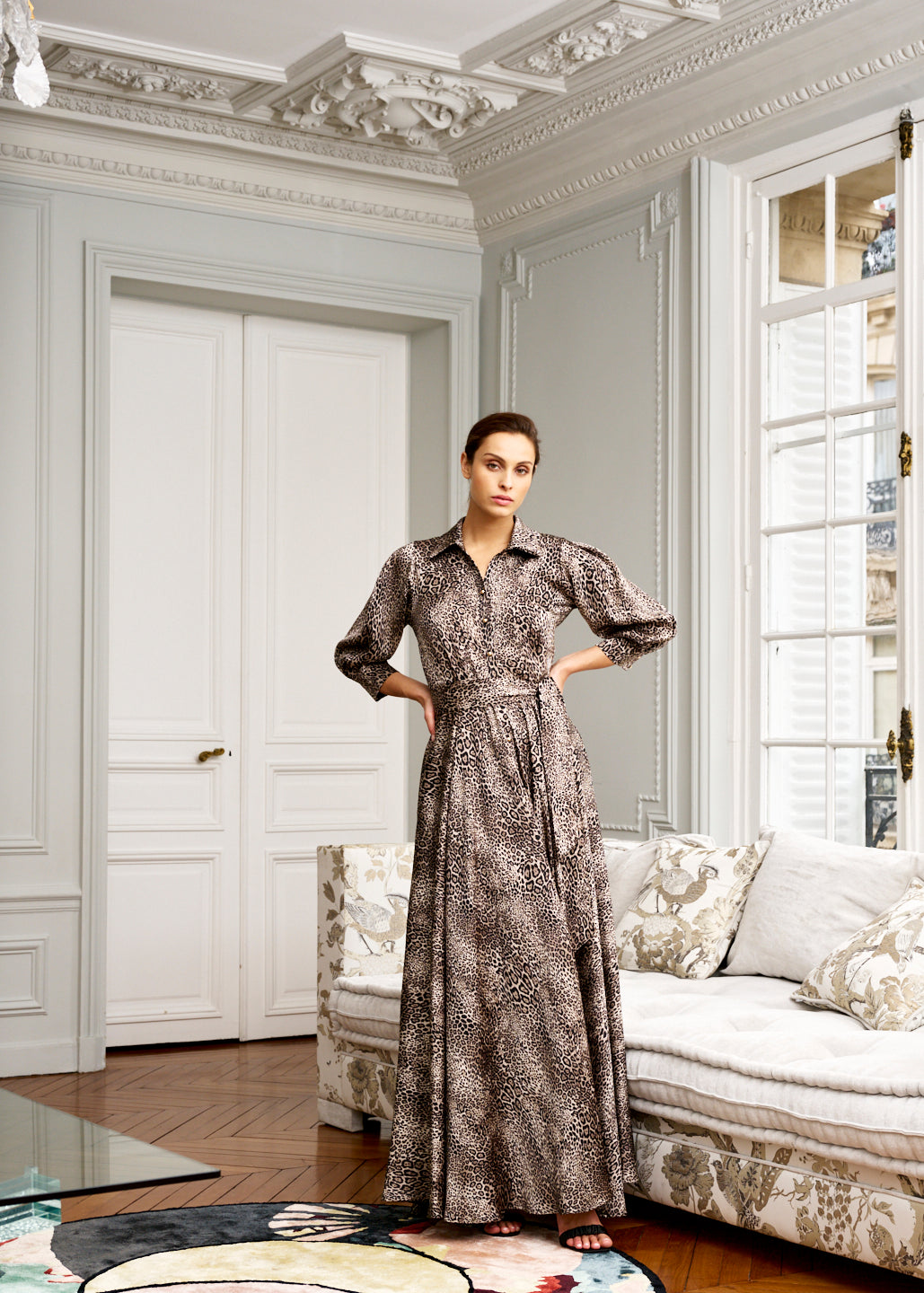 Woman models leopard print shirt dress 