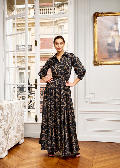 Woman models tailored shirt dress in Parisian apartment